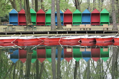 Colorful huts reflecting on calm lake