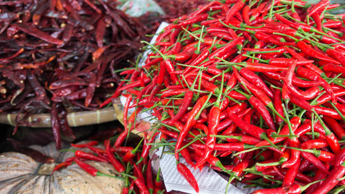 High angle view of red chili peppers in market