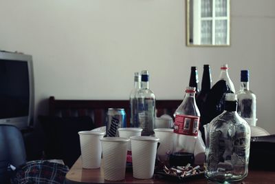 Close-up of bottles on table at home