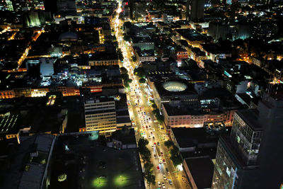 High angle view of city lit up at night