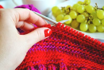 Cropped image of woman netting wool