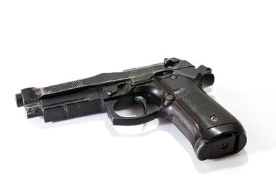 Close-up of gun against white background