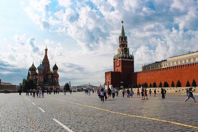 People walking in front of against sky st. basil cathedral