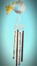 Low angle view of traditional windmill against blue sky