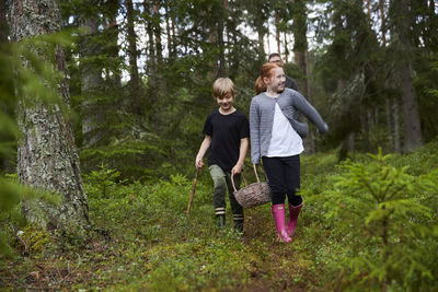 Kids walking through forest
