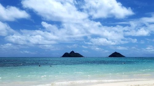 Scenic view of sea against blue sky