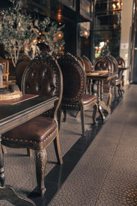 Empty chairs and tables in restaurant