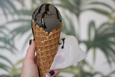 Close-up of hand holding ice cream