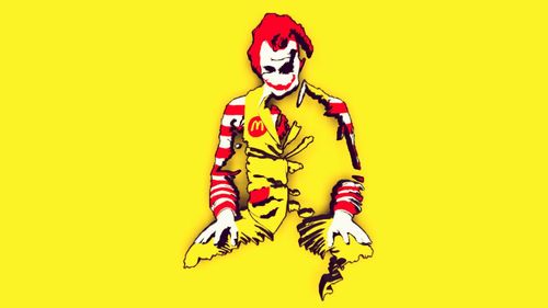 Portrait of man with arms outstretched against yellow background