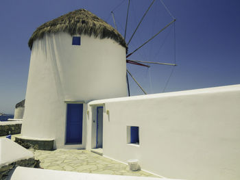 Bakcyard of a windmill in mykonos, greecelow angle view of built structures