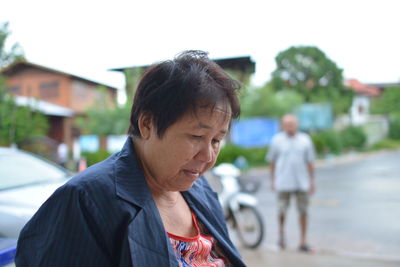 Close-up of woman against blurred background