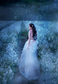 Young woman standing on field