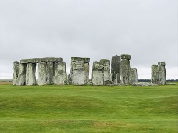 Built structure on field against sky