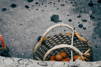 High angle view of fruits in basket on beach