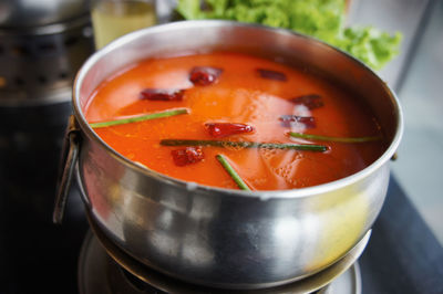 Close-up of red chili peppers on table