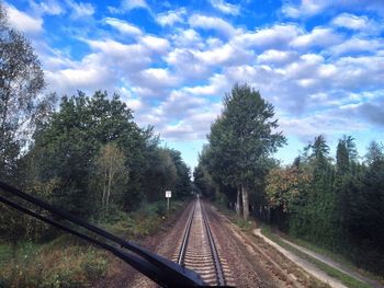 Railroad track seen through train windshield