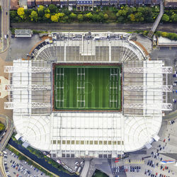 Old trafford football stadium of manchester united, top down drone shot.