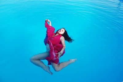 High angle view of woman swimming in pool