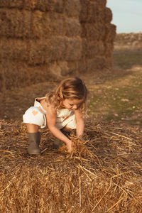 Full length of cute girl on field