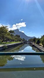 Scenic view of mountains against blue sky