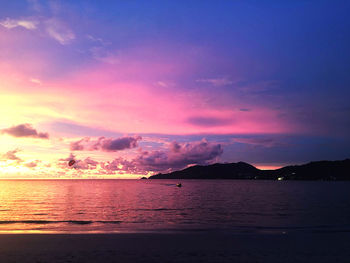 Scenic view of sea against sky at sunset