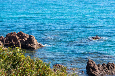 High angle view of rocks in sea