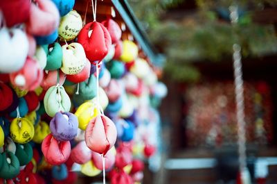 Multi colored decorations hanging in market