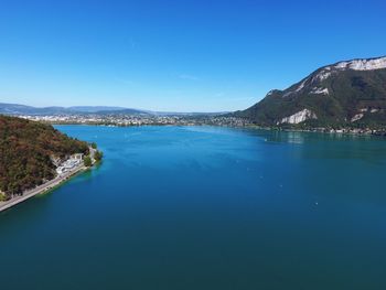 Scenic view of calm sea against clear blue sky