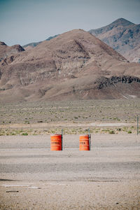 Scenic view of desert against mountain range