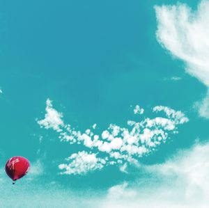 Low angle view of balloons against sky