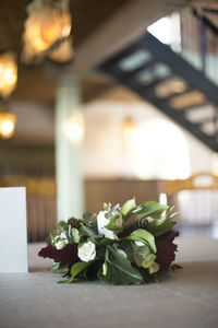 Close-up of rose plant on table