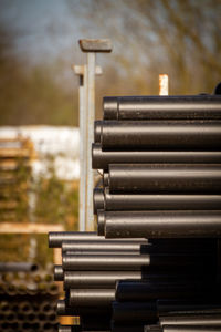 Stack of pipes against a soft background