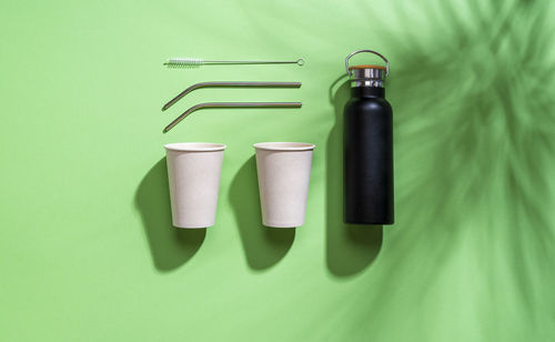 High angle view of bottles on green bottle