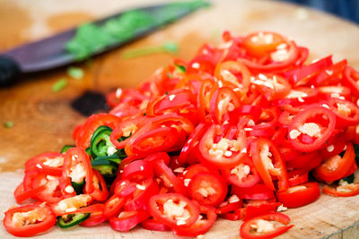 Close-up of red chili peppers on table