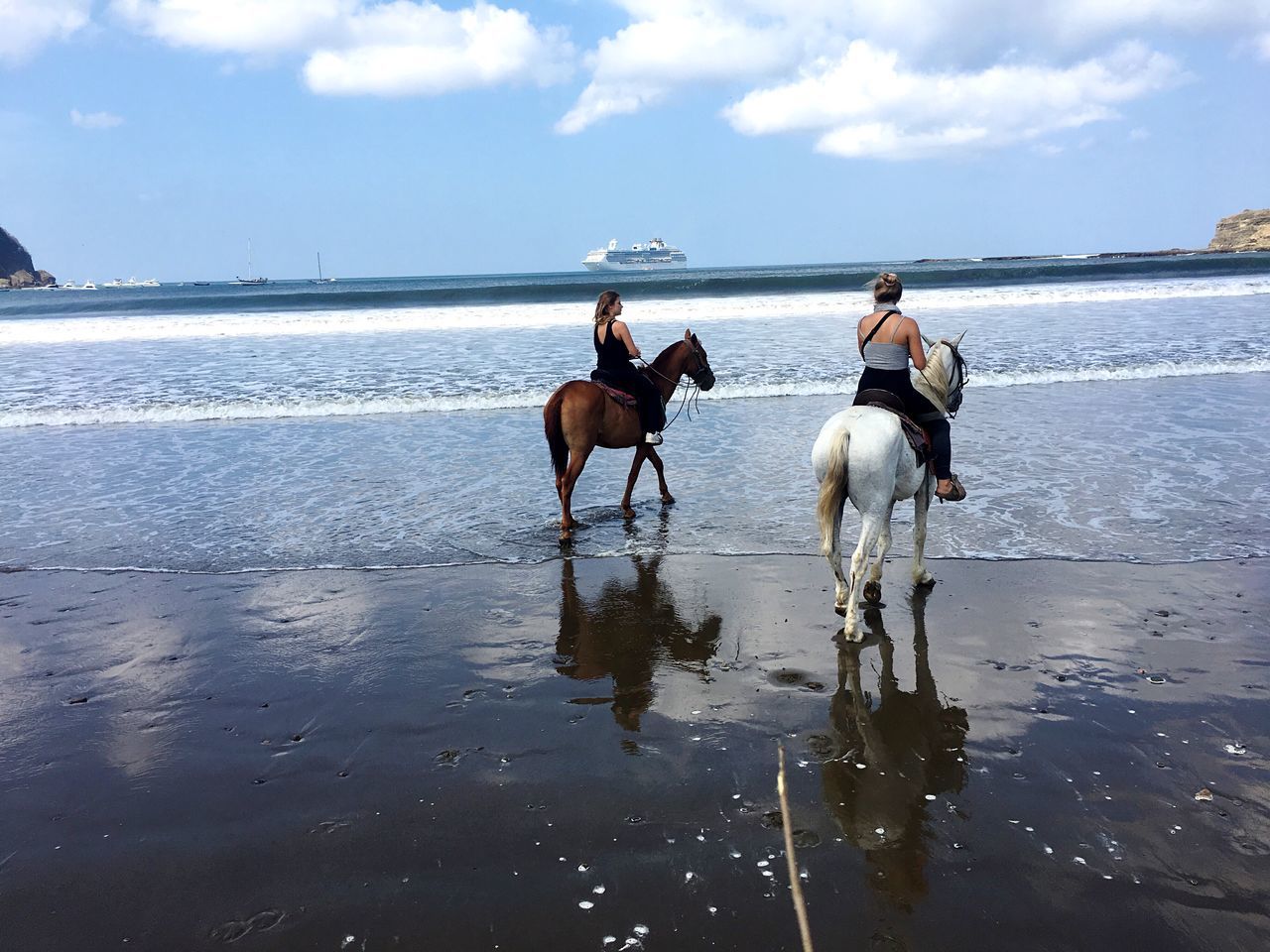 horse, domestic animals, horseback riding, sea, beach, sky, riding, mammal, water, nature, men, real people, sand, cloud - sky, outdoors, day, horizon over water, horse racing, beauty in nature, people