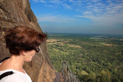 Woman looking at mountain landscape