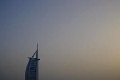 Low angle view of windmill against clear sky