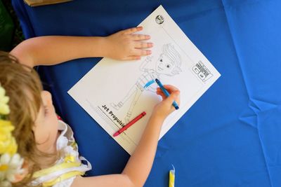 Close-up of baby hand holding paper