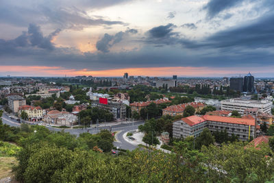 High angle shot of townscape against sky at sunset