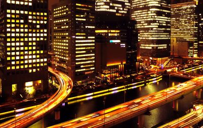 Illuminated modern buildings in city at night