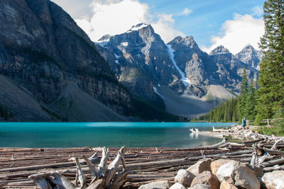 Scenic view of lake and mountains against sky