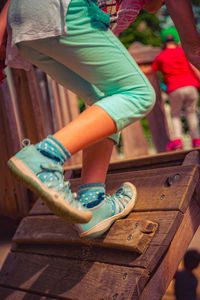 Low section of girl playing at playground