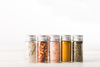 Close-up of drink in jar against white background