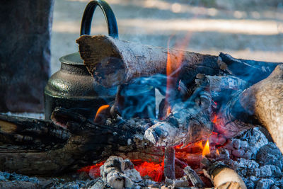 Close-up of campfire on field