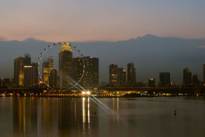 Illuminated city at waterfront