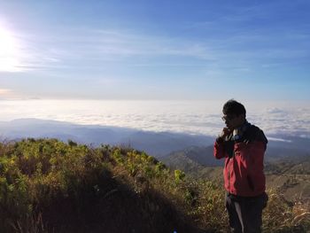 Full length of man standing on land against sky