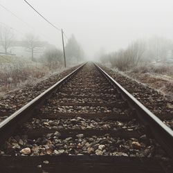 Railroad track in foggy weather