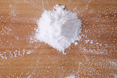 Directly above shot of ice cream over water against gray background