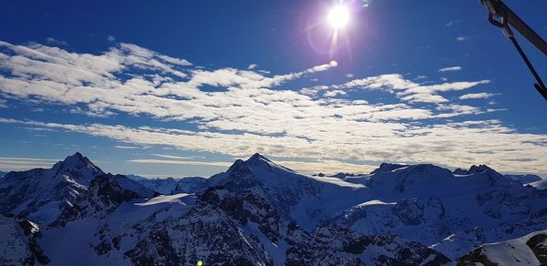 Scenic view of snowcapped mountains against sky during winter