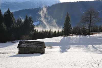 Scenic view of snow covered landscape against sky